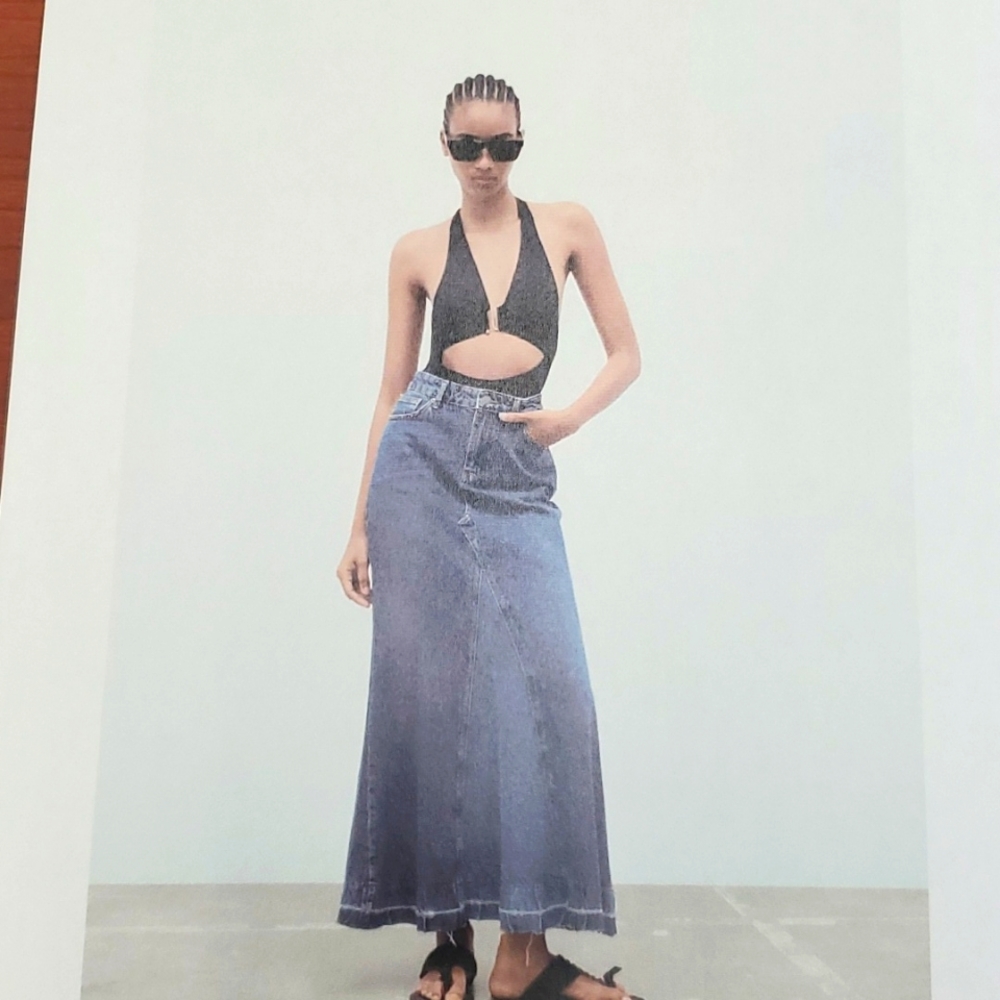 High waisted long denim skirt. Belt loops and 5 pockets   zip and button closure